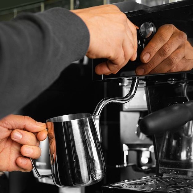 Close-up barista preparing drink