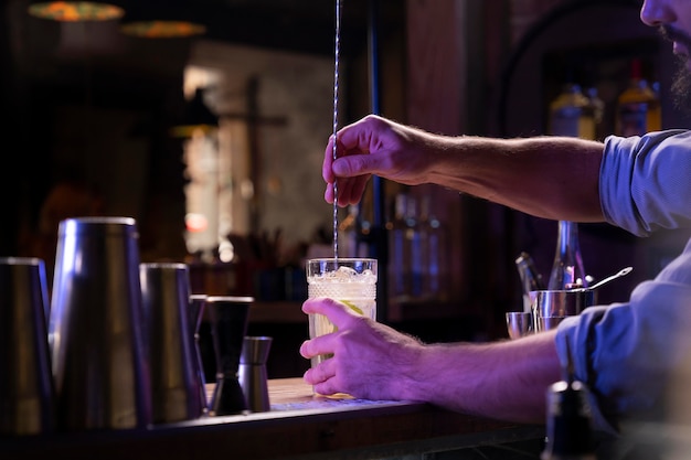 Free photo close up on bartender and cocktail shaker