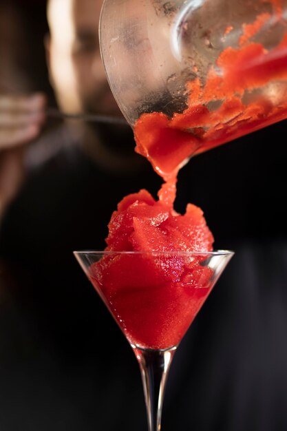 Close up on bartender creating delicious drink