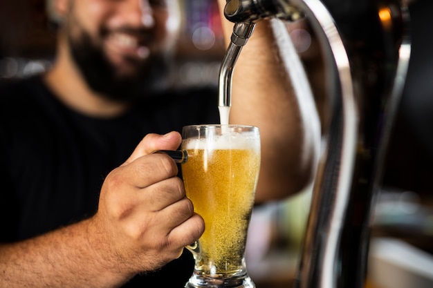 Close up on bartender creating delicious drink