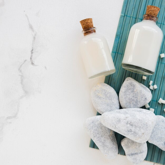 Close-up bath products in glass containers with rocks