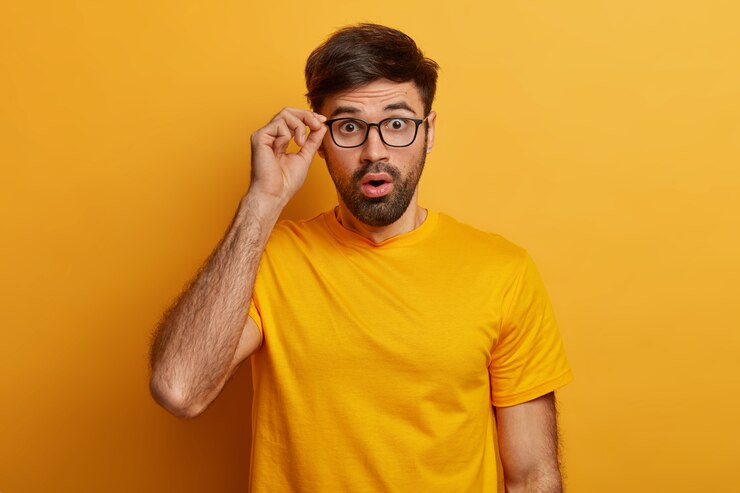 Free Photo close up on bearded young man wearing glasses isolated