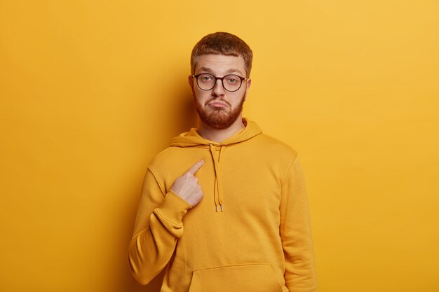 Close up on bearded young man wearing glasses isolated