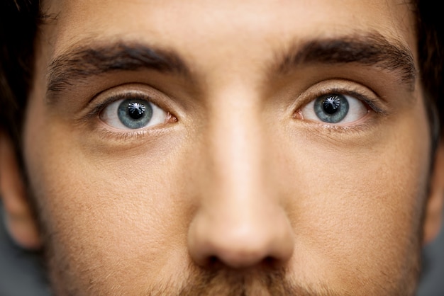 Close-up of beautiful blue eyes of man