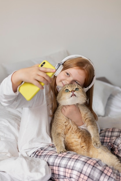 Close up on beautiful cat with little girl