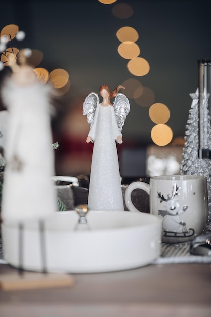 Close up of beautiful figurine on background of lights. New Year eve concept