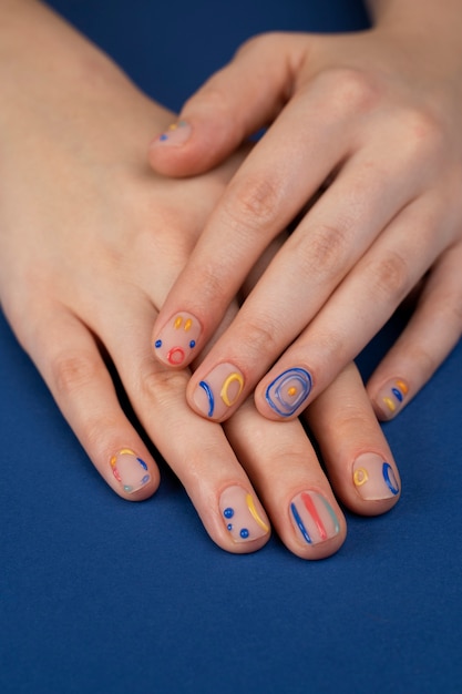 Close up beautiful manicure and blue background