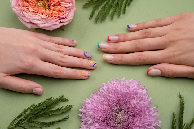 Close up beautiful manicure and flowers