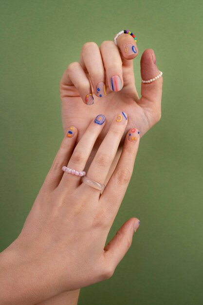 Close up beautiful manicure and green background