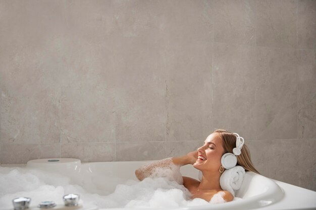 Close up on beautiful woman taking a bath