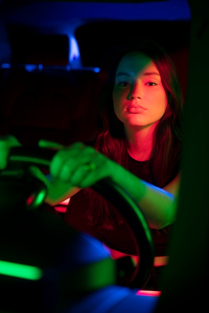 Close up on beautiful young woman driving