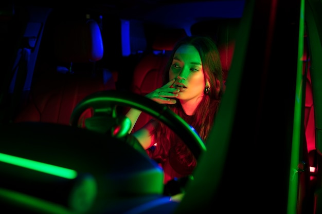 Close up on beautiful young woman driving