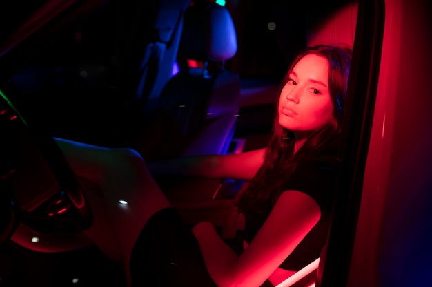 Close up on beautiful young woman inside car