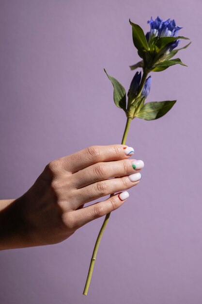 Close up on beauty nail art with flower