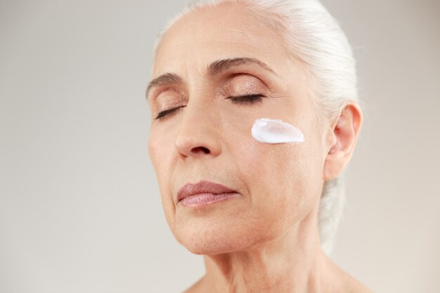 Close up beauty portrait of a tranquil elderly woman