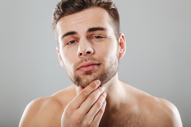 Close up beauty portrait of a young bearded man