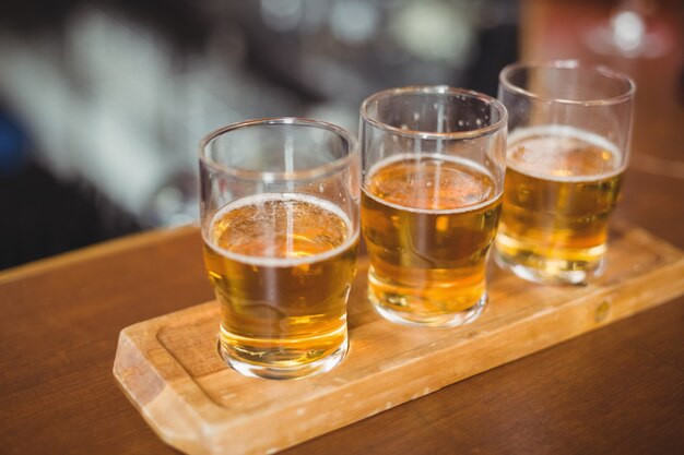 Close-up of beer glasses on the bar counter