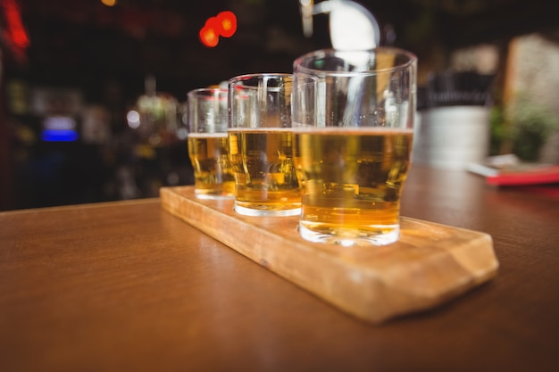 Close-up of beer glasses on the counter