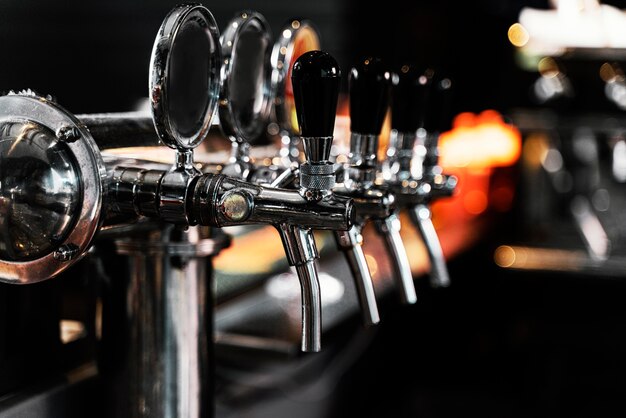 Close-up beer machine in pub