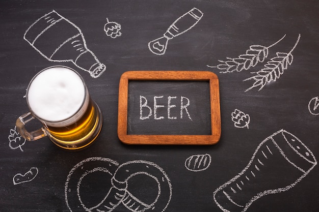 Free photo close-up beer with chalkboard background