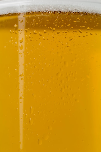 Close-up beer with foam in transparent glass