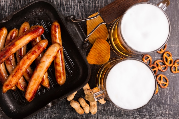 Close-up beer with sausages