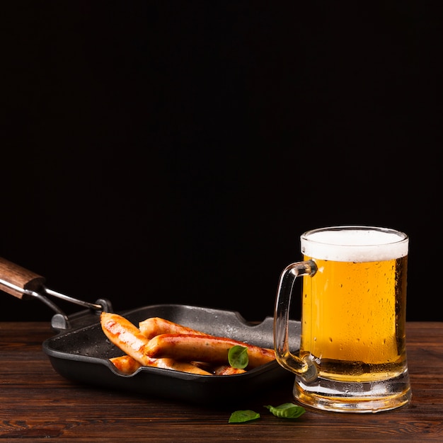 Close-up beer with sausages