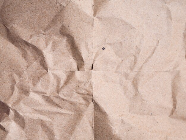 Close-up beige crumpled paper background