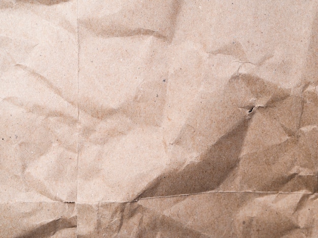 Close-up beige crumpled paper background