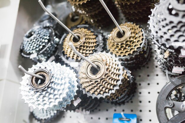 Close-up of bicycle chainrings in workshop