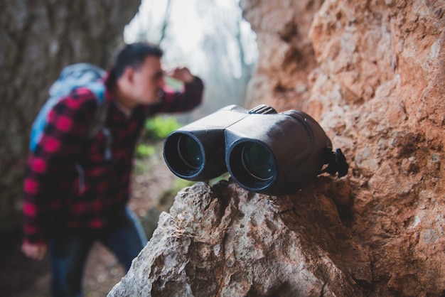 Free photo close-up of binoculars on a rock