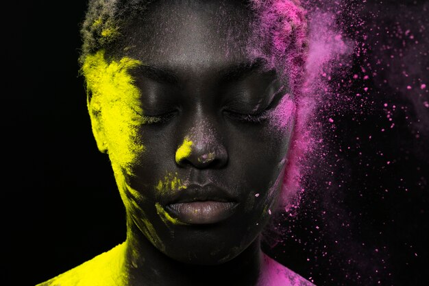 Close up black model posing with powder