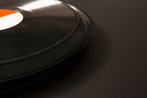 Close-up of black vinyl record on black background