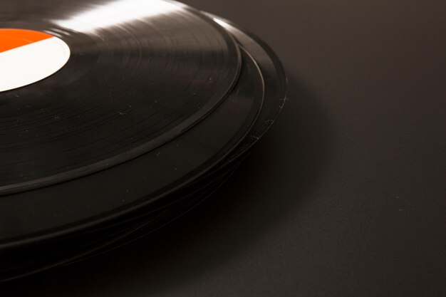 Close-up of black vinyl record on black background