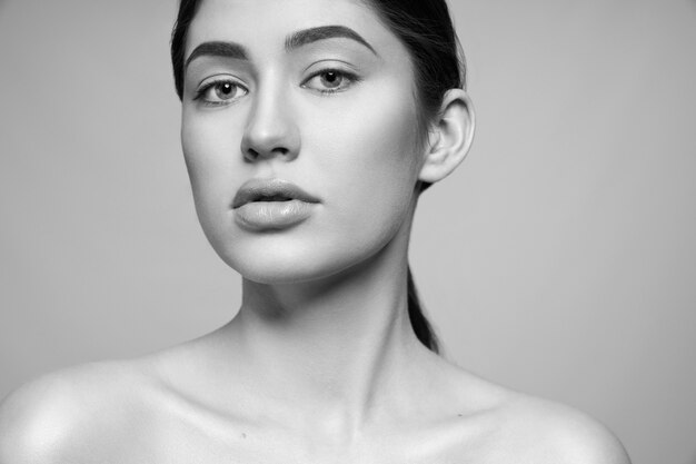 Close up black and white portrait of model with perfect skin