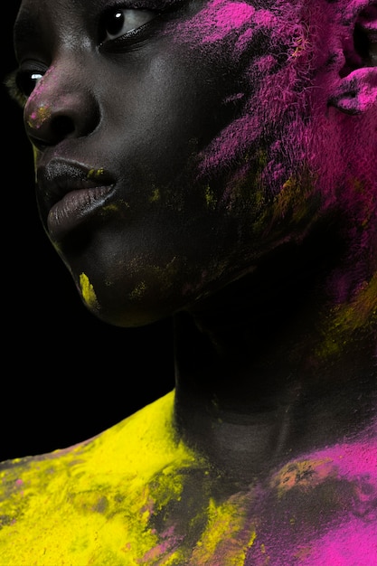 Free photo close up black woman posing with powder