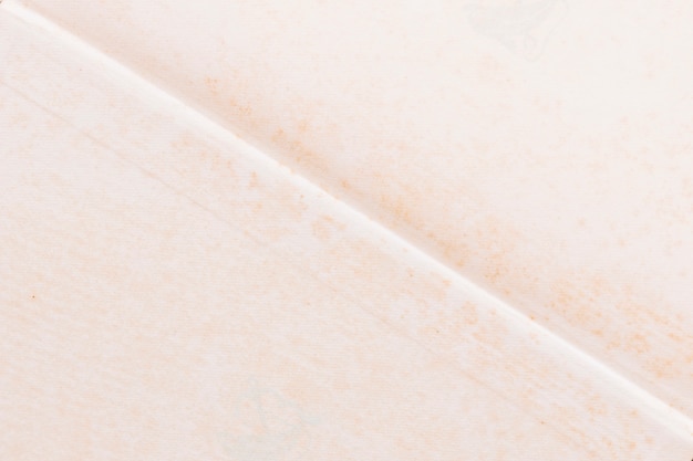 Free photo close-up of blank white grunge paper with cross line