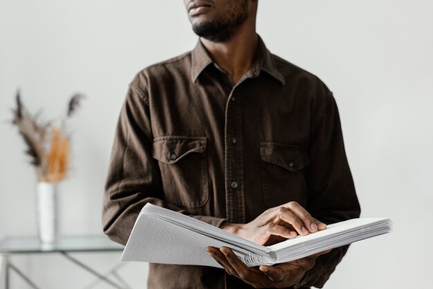 Close up blind man reading braille