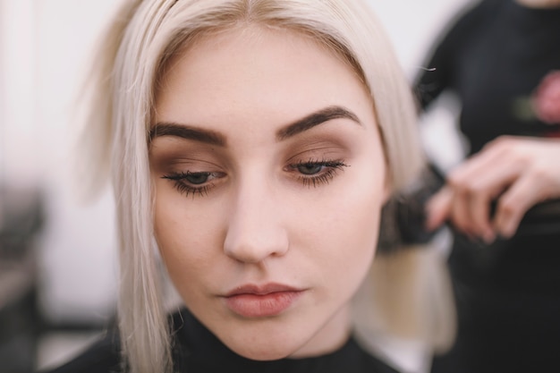 Close-up of blonde in hair salon