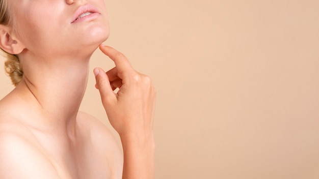 Close-up blonde woman with copy-space posing