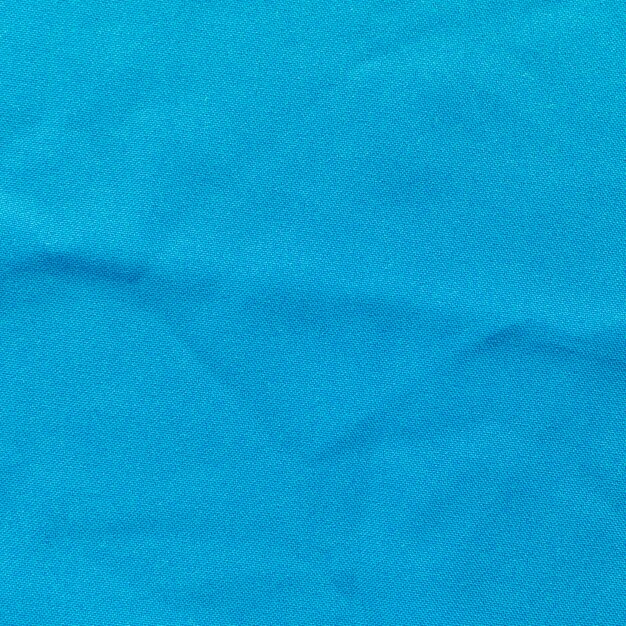 Крупным планом синий текстурированный фон ткани