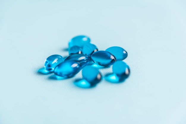 Close up of blue medical gel capsules