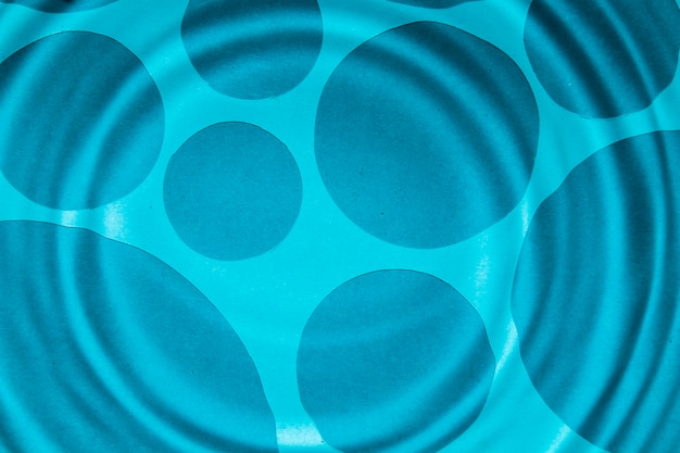 Close-up blue water rings and darker spots