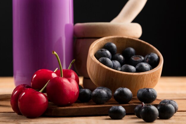 Close-up blueberries and cherries with smoothie