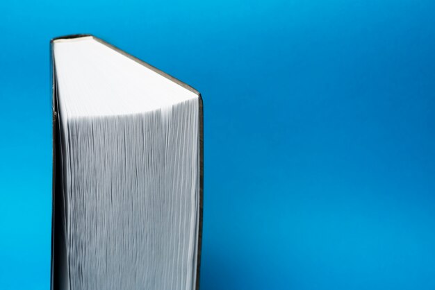 Close-up of book with blue background