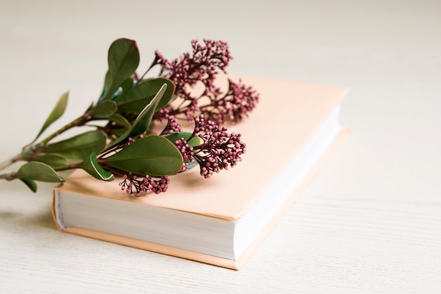Close-up of book with flowers