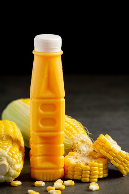 Close up on bottle of corn juice ready to eat