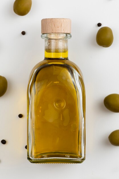 Close-up bottle with fresh olive oil