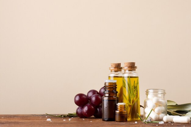 Close-up bottles with oil and pills on the table