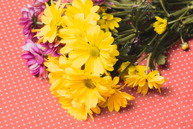 Close-up of bouquet with yellow and purple flowers